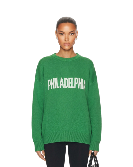 Female model wearing South & Green's Unisex Knit PHILADELPHIA Essential Sweater, standing in front of a white background.