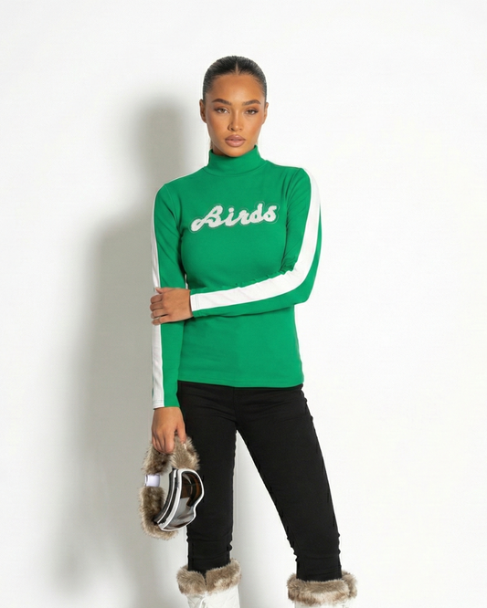 Model wearing South & Green's Retro BIRDS Turtleneck sweater up against a white background.