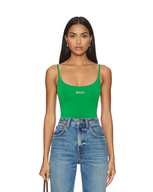 Model wearing South & Green's BIRDS Bodysuit with a pair of distressed jeans, standing in front of a white background.