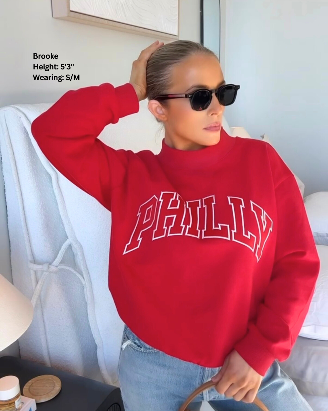 Brooke wearing Red PHILLY Varsity Mockneck in Size S/M.