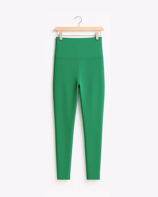 Kelly Green Yoga Pants from South & Green on a hanger against a white background.