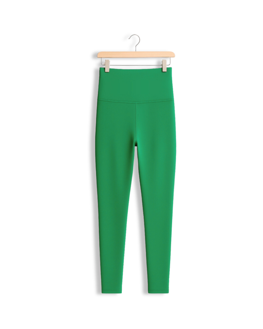 Kelly Green Yoga Pants from South & Green on a hanger against a white background.