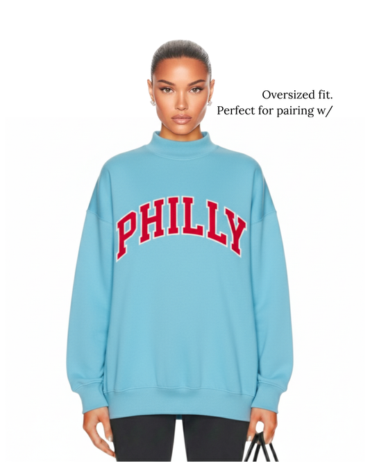 Model wearing S&G Blue PHILLY Varsity Mockneck